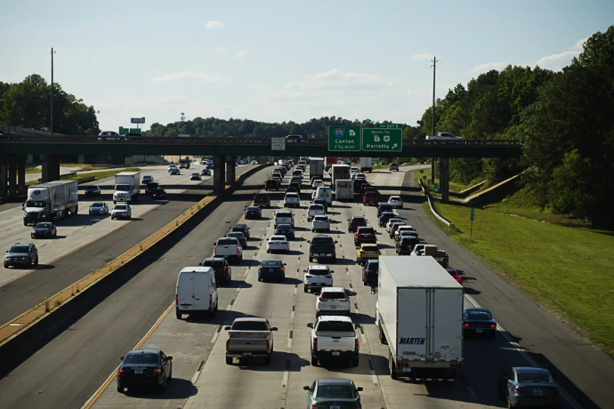 Cars and trucks congest a busy highway.